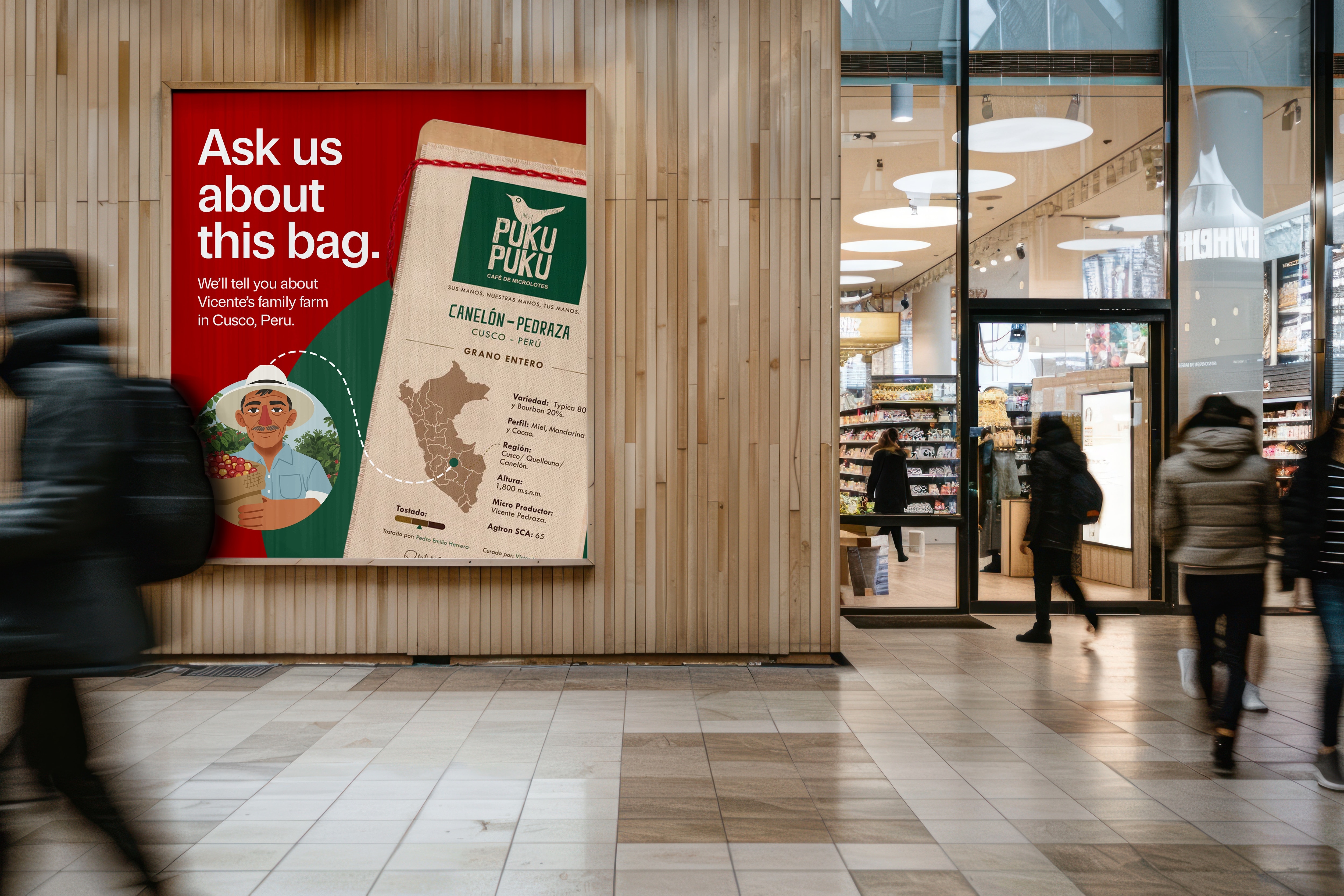 Poster on a wooden wall beside a grocery store entrance, shoppers blurring past: Ask us about this bag. We’ll tell you about Vicente’s family farm in Cusco, Peru. A dashed line runs from an illustration of Vicente to his farm on the bag’s map.