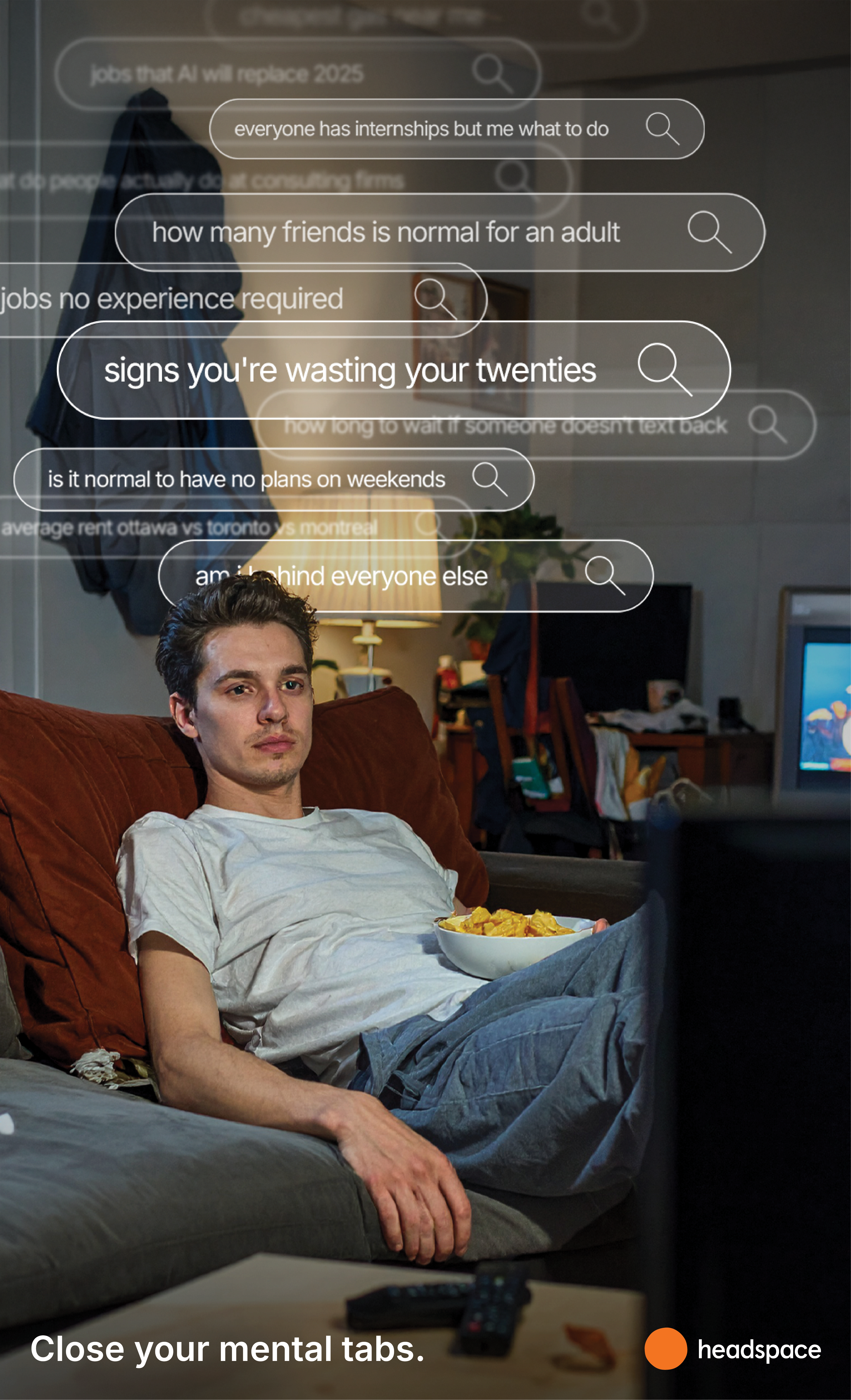 Young man relaxing on couch with mental search queries floating overhead
